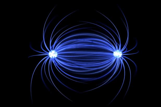 Conceptual image showing blue magnetic field lines leaving both ends of a dipole and connecting in the middle