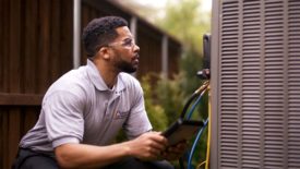 Technician Reading a Gauge